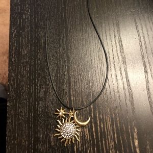 Necklace with moon sun and star